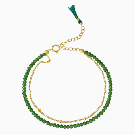 Double-layer bracelet with Emerald green gemstone beads and gold chain accents, adjustable clasp.