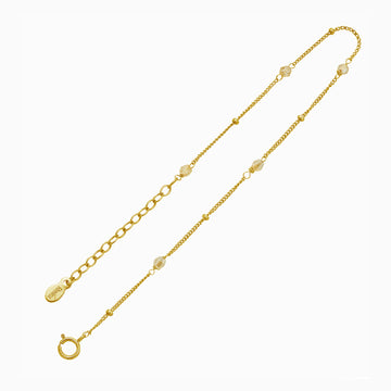 Delicate 14k gold satellite bracelet with champagne colored crystals by Desideri design