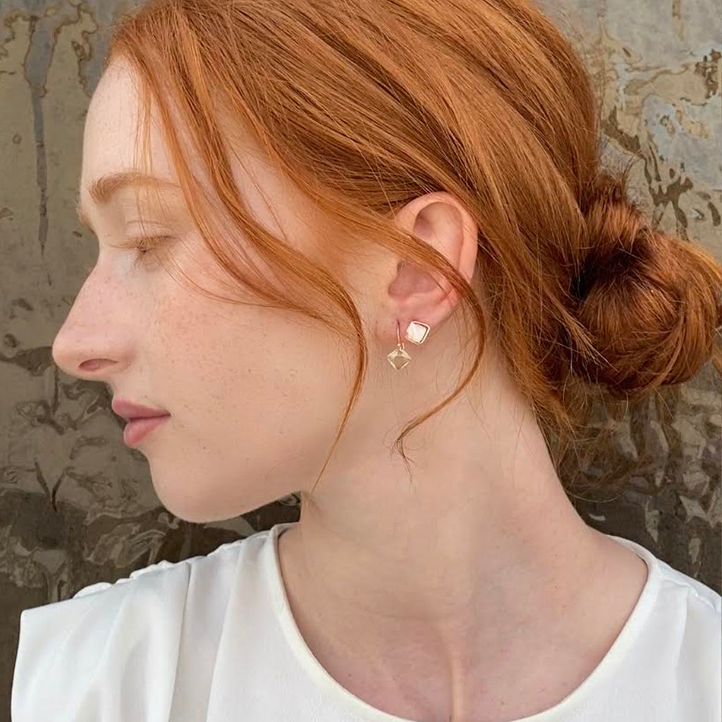 Geometric gold studs and dangling earrings