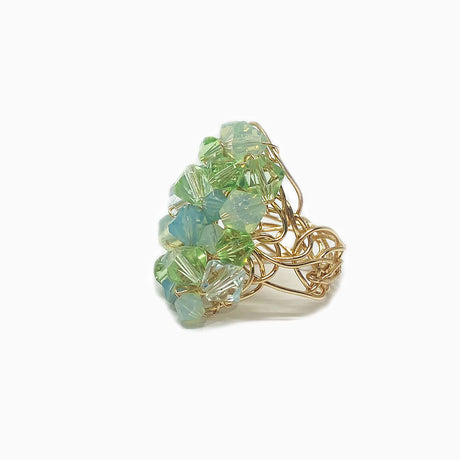 light shades of lime green crystals mounted on gold filled wire band. spring ring
