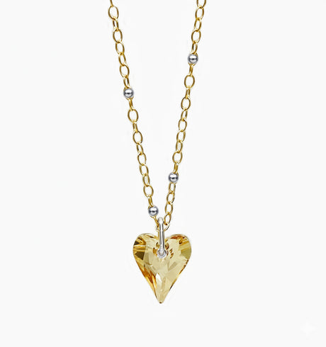champagne colored crystal heart with silver and gold satellite chain