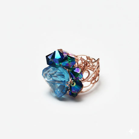 Aquamarine blue crystals mounted on rose gold wire ring band