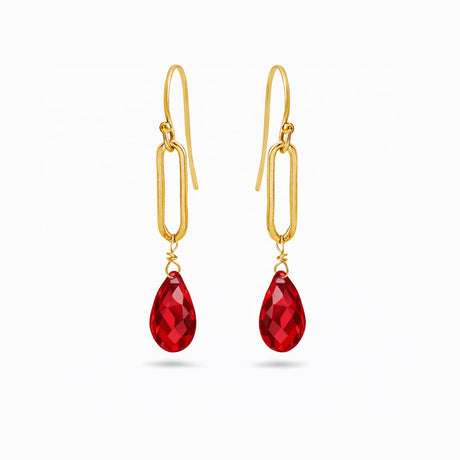 Gold earrings with red teardrop-shaped ruby red crystals. Valentine's gifts